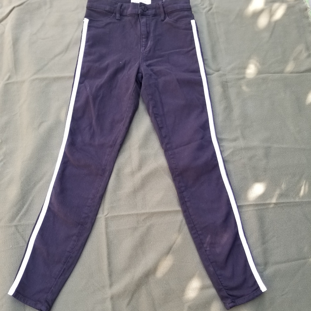 PacSun black denim with gold and white stripes